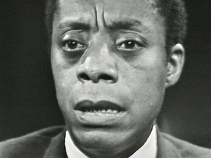 close-up of James Baldwin speaking with furrowed browalr