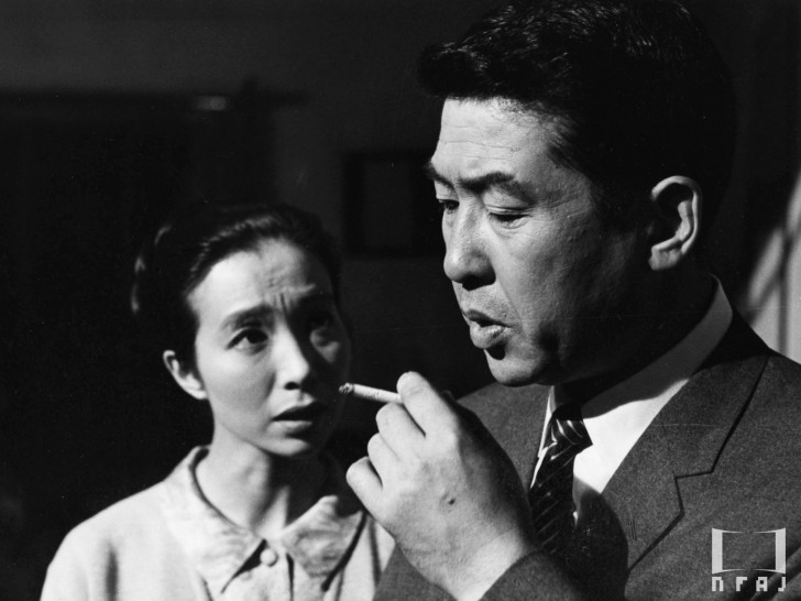 Aratama Michiyo looking desperate as she talks to a smoking Kobayashi Keijualr