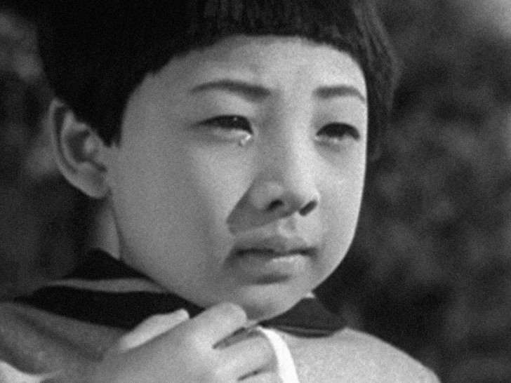 a close-up of a little girl's worried facealr