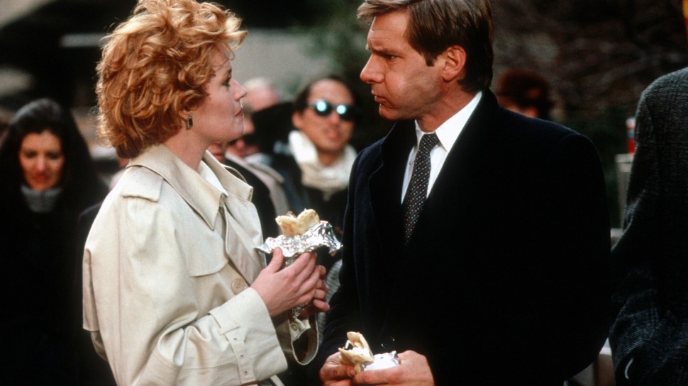 Melanie Griffith and Harrison Ford talking and eating burritos out in the city streetsalr