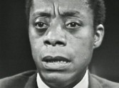 close-up of James Baldwin speaking with furrowed brow