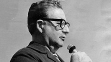 Still of Salvador Allende speaking into microphone