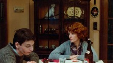 Delphine Seyrig as Jeanne Dielman at the dinner table with her teenage son